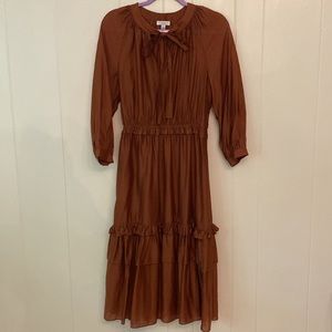 Dark burnt orange midi length dress